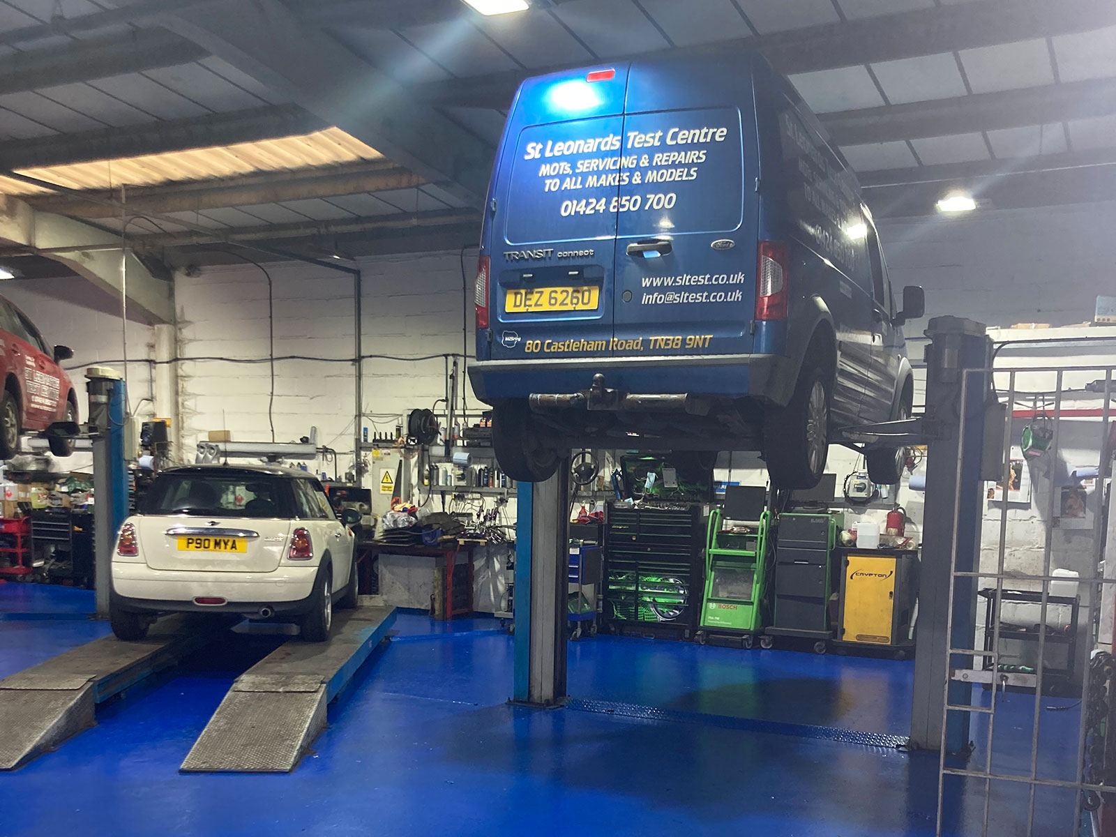 our own van on a ramp being serviced